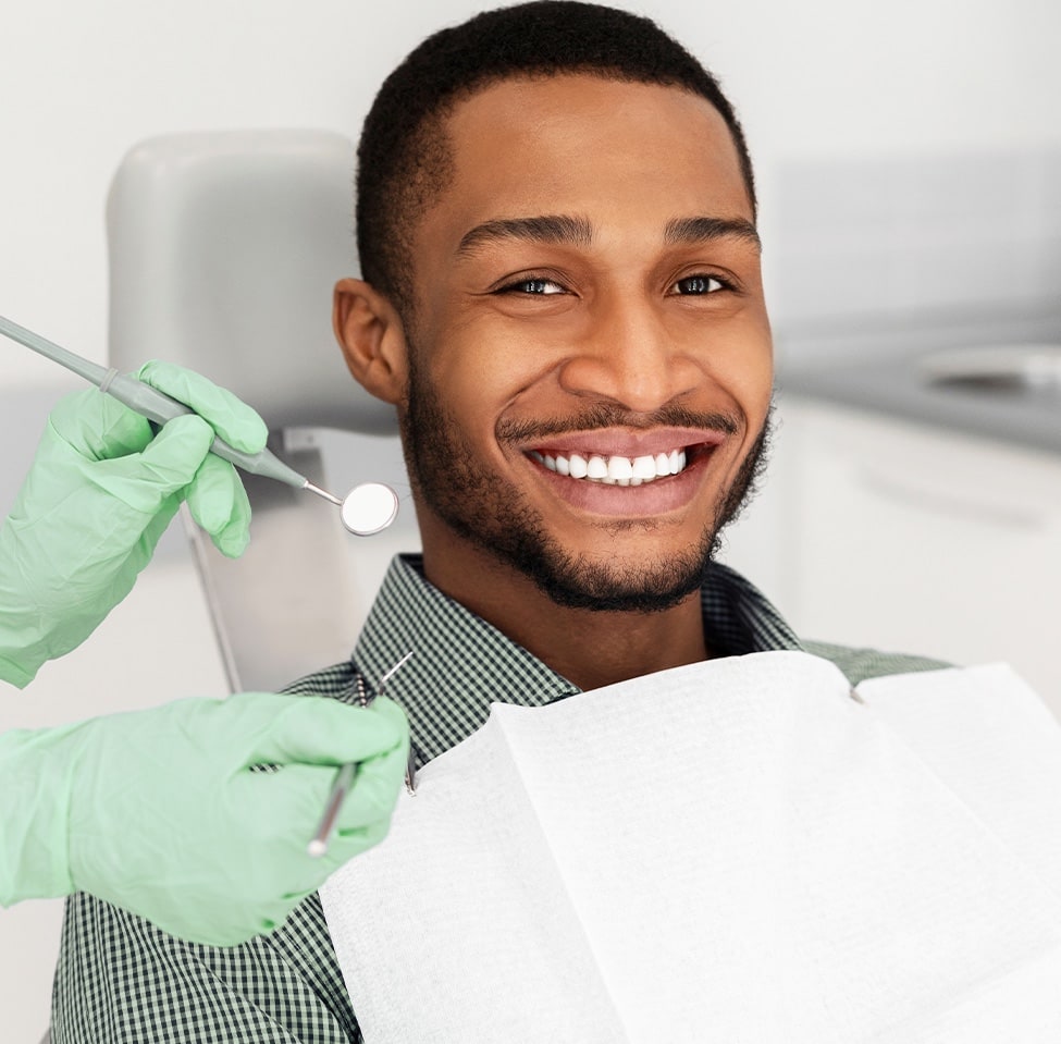 man getting his teeth cleaned